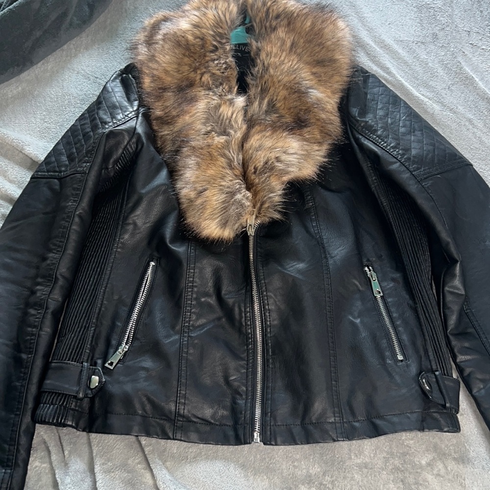 A leather black jacket with brown for extra large worn only one time.